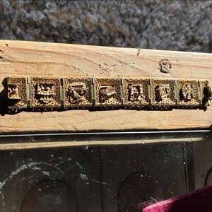 Gold Tone Bracelet with Intricate Designs